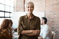 Portrait, senior and business woman with arms crossed in office meeting. Face, confidence and happy female entrepreneur Royalty Free Stock Photo