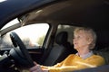 Portrait of a senior business woman learning drive a car. Unsafety drive Royalty Free Stock Photo