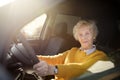 Portrait of a senior business woman learning drive a car. Unsafety drive Royalty Free Stock Photo