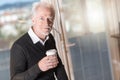 Portrait of senior businessman having coffee break Royalty Free Stock Photo