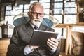 Portrait of senior businessmen working on digital tablet. Royalty Free Stock Photo