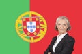 Portrait of senior businesswoman with pride over Portuguese flag