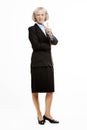 Portrait of senior businesswoman standing in suit Royalty Free Stock Photo