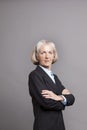 Portrait of senior businesswoman standing in suit Royalty Free Stock Photo