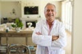 Portrait of senior caucasian male doctor looking at camera and smiling Royalty Free Stock Photo