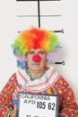 Portrait of senior clown posing for mug shot Royalty Free Stock Photo