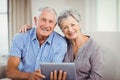 Portrait of senior couple with digital tablet Royalty Free Stock Photo