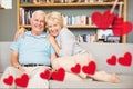 Portrait of senior couple embracing on sofa Royalty Free Stock Photo