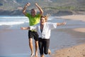 Portrait of senior couple feeling joy of active running Royalty Free Stock Photo