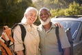 Portrait Of Senior Couple Going For Hike In Countryside Standing By Car Together Royalty Free Stock Photo