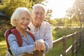 Portrait Of Senior Couple Hiking In Countryside Together Royalty Free Stock Photo