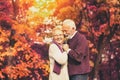 Portrait of senior couple, husband hugging kissing his wife in cheek