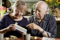 Portrait of Senior Couple with Pill Case