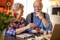 Senior couple reviewing drug prescription online