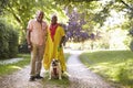 Portrait Of Senior Couple Walking Pet Bulldog In Countryside Royalty Free Stock Photo