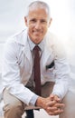 Portrait, senior doctor and happy man in hospital for healthcare, wellness or work in Australia for career. Smile Royalty Free Stock Photo
