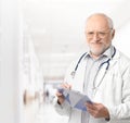 Portrait of senior doctor on hospital corridor Royalty Free Stock Photo