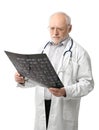 Portrait of senior doctor looking at X-ray image