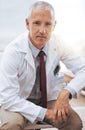 Portrait, senior doctor and serious man in hospital for healthcare, wellness or working in Australia for career Royalty Free Stock Photo