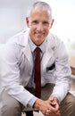 Portrait, senior doctor and smile of man in hospital for healthcare, wellness or working in Australia for career. Happy Royalty Free Stock Photo