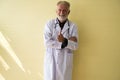 Portrait of senior doctor standing and showing thumb up at hospital,Happy and smiling positive thinking attitude Royalty Free Stock Photo