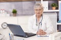 Portrait of senior doctor at work Royalty Free Stock Photo