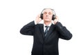 Portrait of senior elegant man enjoying listening to headset Royalty Free Stock Photo