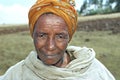 Portrait of senior Ethiopian woman with flies