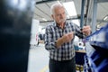 portrait senior factory worker in industrial workshop Royalty Free Stock Photo