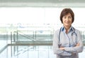 Portrait of senior female doctor on corridor Royalty Free Stock Photo