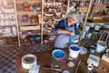 Senior female pottery artist in her art studio