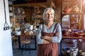 Senior female pottery artist in her art studio