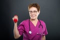 Portrait of senior lady doctor holding dumbbell Royalty Free Stock Photo