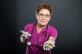 Portrait of senior lady doctor offering bunch of pills Royalty Free Stock Photo