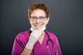 Portrait of senior lady doctor wearing mask and smiling Royalty Free Stock Photo