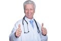 Portrait of senior male doctor with stethoscope showing thumb up Royalty Free Stock Photo