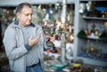 Portrait of senior male holding vintage souvenir