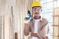 Portrait of senior man carpenter holding  the hand drill, standing in carpentry woodwork workshop, old craftsman enjoy his DIY Royalty Free Stock Photo