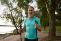 Portrait of senior man enjoying beautiful park scenery during hike in summer Royalty Free Stock Photo