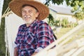 Portrait of senior man in a hat relaxing in a hammock Royalty Free Stock Photo