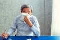 Portrait of senior man having sick with paper wipe blowing his n Royalty Free Stock Photo