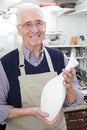 Portrait Of Senior Man Holding Vase In Pottery Studio Royalty Free Stock Photo