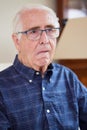 Portrait Of Senior Man At Home Suffering From Stroke Showing Dropped Side Of Face Royalty Free Stock Photo