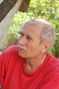 Portrait of a senior man in red.