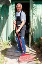 Man working with garden rake Royalty Free Stock Photo