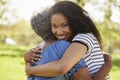 Portrait Of Senior Mother With Adult Daughter Hugging In Park Royalty Free Stock Photo