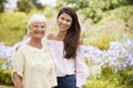 Portrait Of Senior Mother With Adult Daughter On Walk In Park Royalty Free Stock Photo