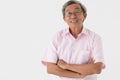 Portrait of a senior older Asian man good positive looking pose with happy and confident to camera on white background Royalty Free Stock Photo