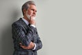 Portrait of senior pensive curious rich wealthy man isolated Royalty Free Stock Photo