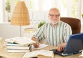 Portrait of senior professor sitting at desk